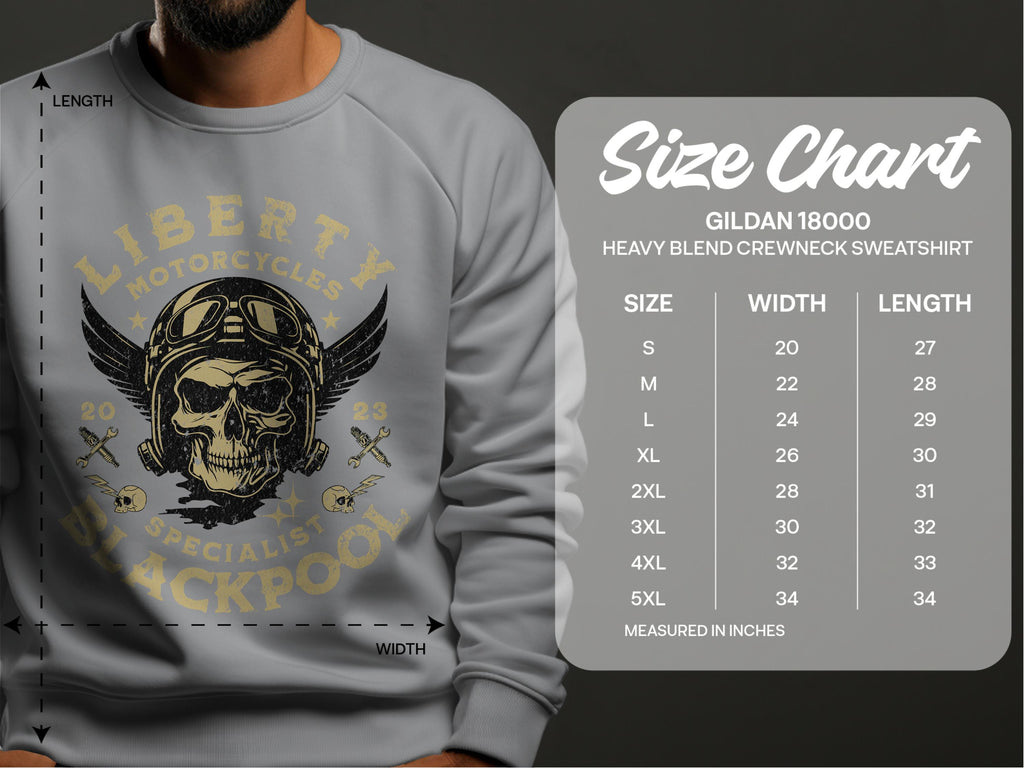 A man wears a Garment Graphics gray sweatshirt with a skull and motorcycle design, text Liberty Motorcycles Specialist Blackpool. Discover your fit with the Gildan 18000 size chart, available in sizes S to 5XL for Blackpool 2023 Sweatshirts. Measurements provided in inches.