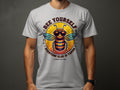 Someone sporting a Garment Graphics gray T-shirt with a bee in sunglasses. The shirt reads Bee Yourself above and Every One Else Is Taken below, with Summer Edition! at the bottom over a sunburst background. Ideal for family sizing!.
