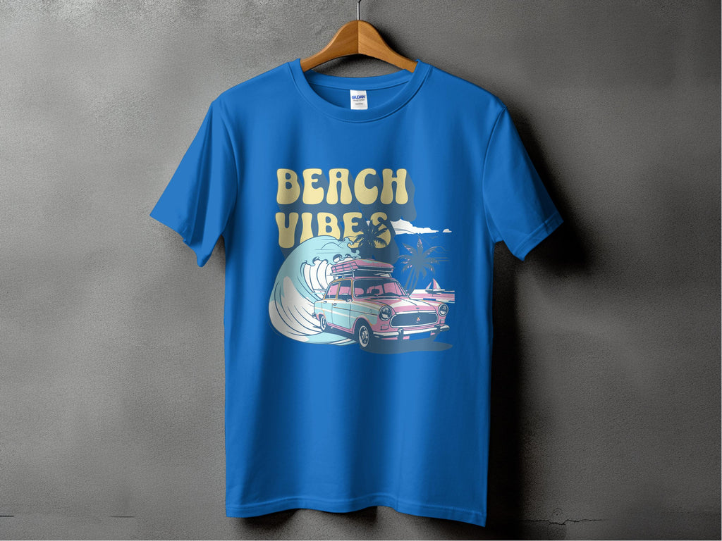 Garment Graphics presents a graphic T-shirt on a hanger featuring a classic car with surfboards, surrounded by waves and palm trees. BEACH VIBES in retro font embodies sun-kissed adventures.