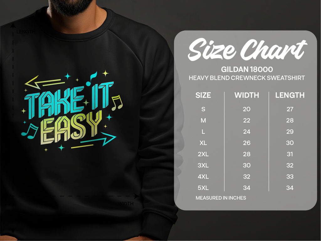 A person wears a black sweatshirt from Garment Graphics featuring the bold, colorful Take It Easy design with arrows and musical notes. Nearby, a Gildan 18000 size chart shows unisex sizes from S to 5XL with measurements in inches.