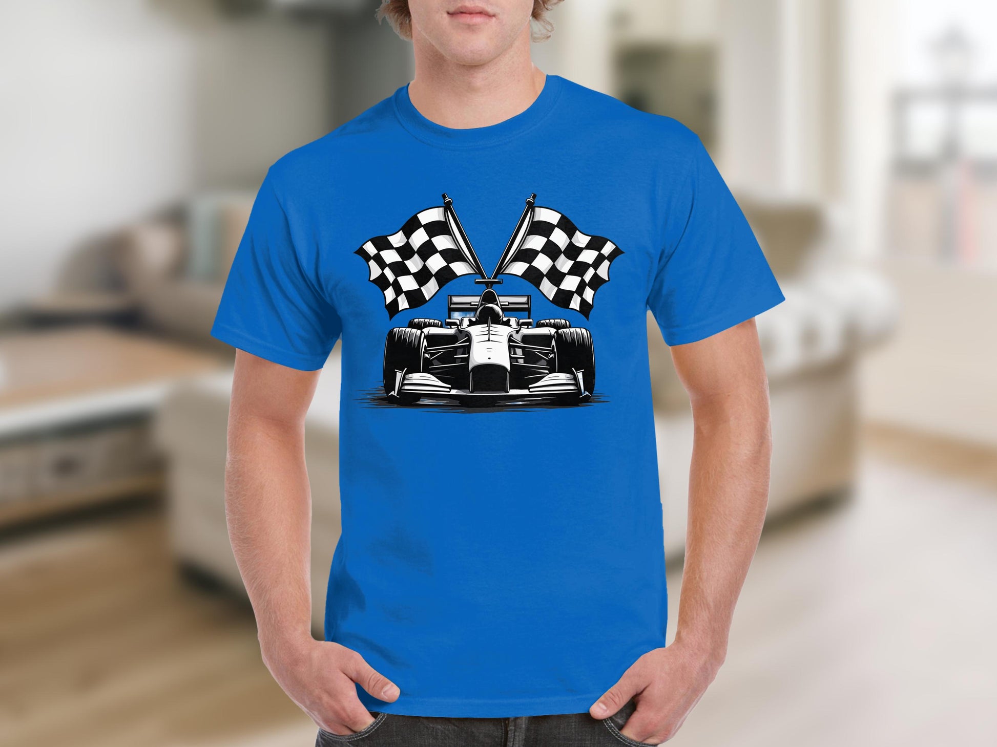 The person is wearing a Garment Graphics blue T-shirt with a racing car and two checkered flags design, set against an indoor backdrop that subtly nods to the excitement of Formula One.