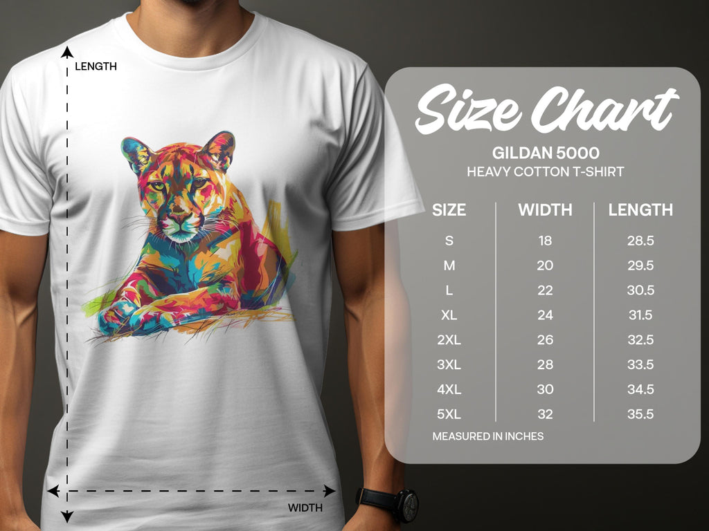 A man wears a white Garment Graphics T-shirt featuring a vibrant seated tiger graphic. Beside him is a size chart for Gildan 5000 T-shirts, showing sizes S to 5XL with width and length in inches.