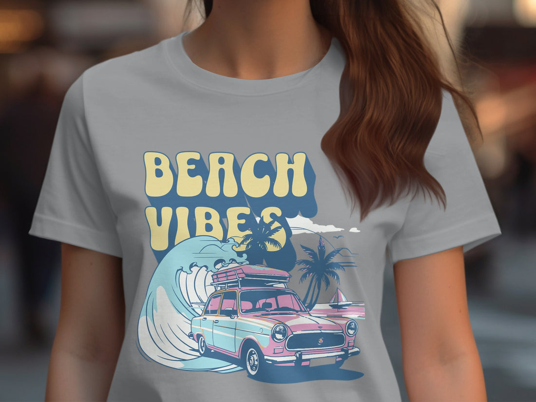 Garment Graphics presents a retro t-shirt showcasing a surf design with a vintage car, surfboard, and palm tree. The Beach Vibes text adds charm to the wooden backdrop adorned with holiday decorations like wrapped gifts, pine cones, and candy canes.