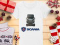 Celebrate the season with Garment Graphics Scania T-shirt. This white tee boasts a Scania truck graphic and logo, accented by festive decor such as wrapped gifts, pinecones, red stars, a cozy sweater, and candy canes on a wooden surface—ideal for automotive enthusiasts.
