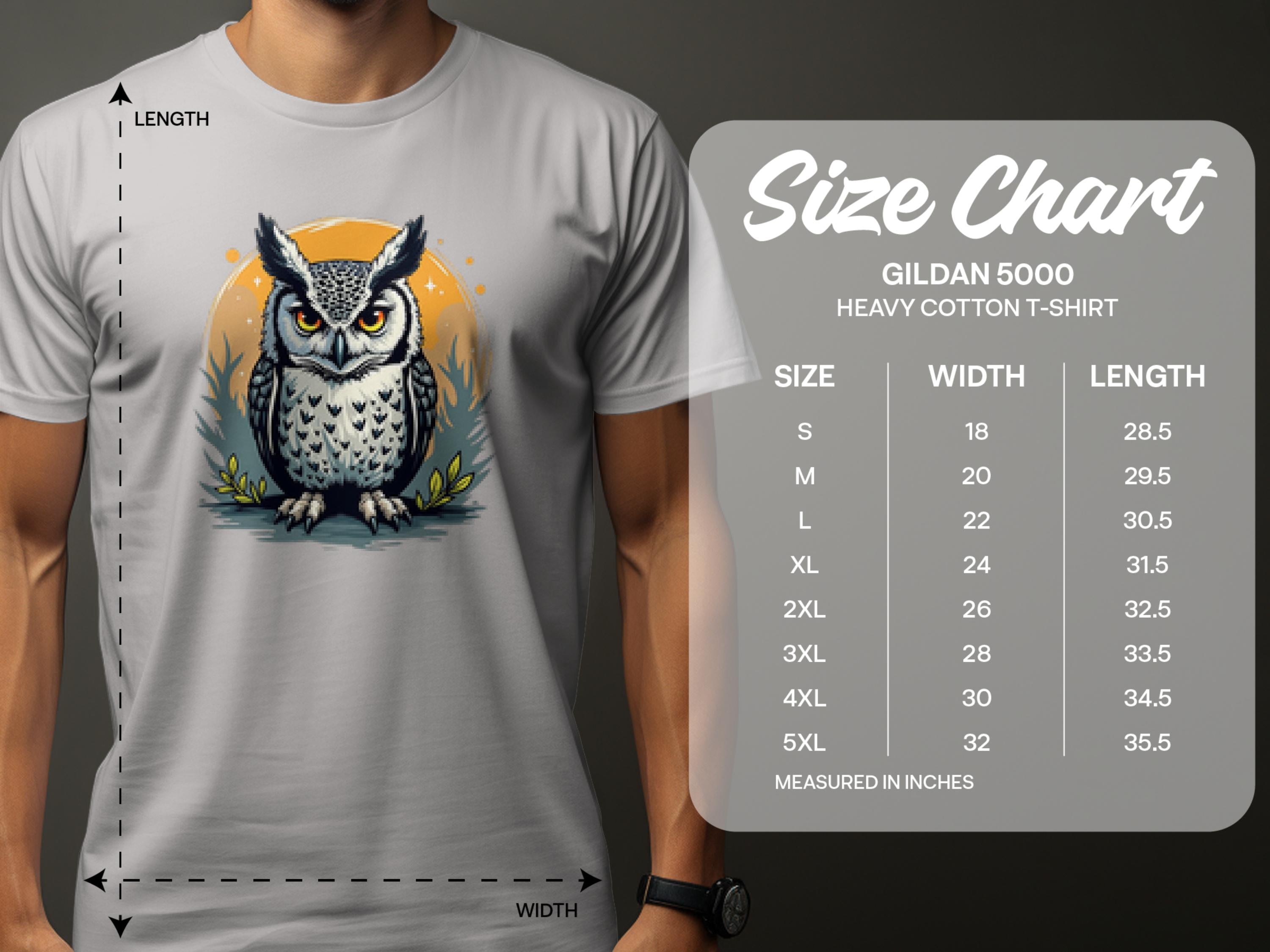 A person is wearing a Garment Graphics white T-shirt featuring an owl graphic with a yellow circle, adding artistic flair. Beside it, a size chart for the Gildan 5000 Heavy Cotton T-Shirt shows sizes S-5XL with corresponding width and length measurements in inches.