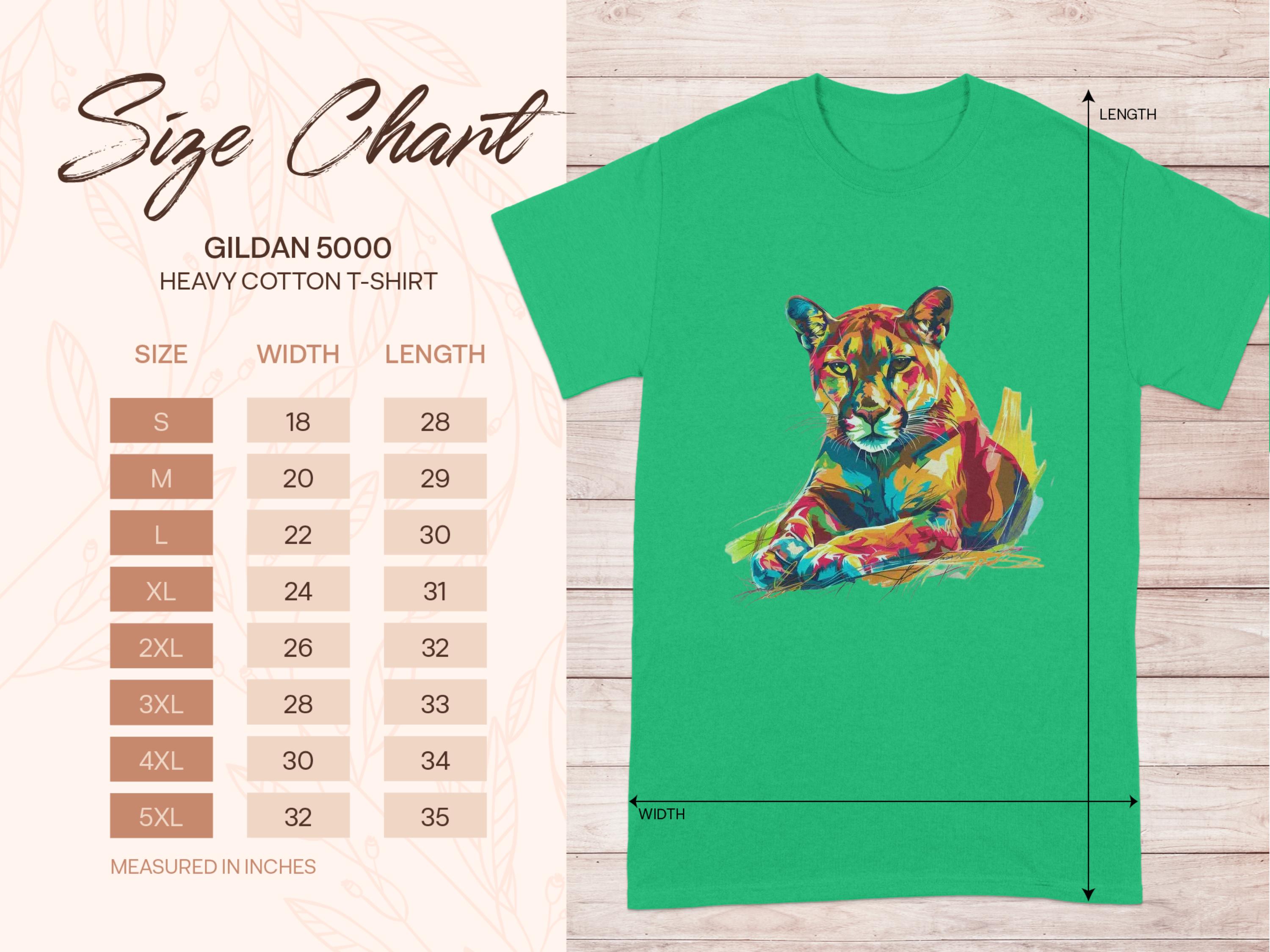 A green t-shirt with vibrant artwork of a colorful roaring cougar by Garment Graphics features a size chart on the left side for Gildan 5000 heavy cotton graphic print T-Shirts, offering sizes S to 5XL with measurements in inches, ranging from 18x28 to 34x35.