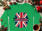 Garment Graphics offers a cozy green sweatshirt with a bold distressed Union Jack and the text Dont Blame Me, I Didnt Vote For Him, styled amidst holiday decor like ornaments, pine branches, and a warm cup of coffee.