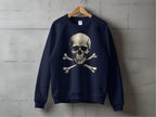 A bold, edgy navy sweatshirt featuring a skull and crossbones graphic from Garment Graphics hangs on a wooden hanger against a concrete wall.
