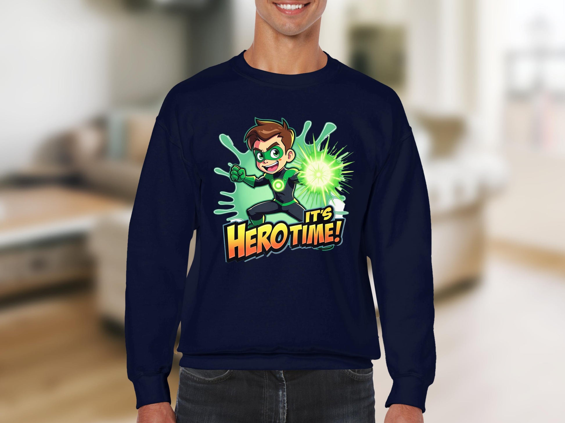 Wearing Garment Graphics unisex navy cartoon-themed sweatshirt, a character with spiky brown hair holds a glowing green energy source above the text Its Hero Time! against a blurred indoor background.