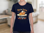 Garment Graphics navy blue womens T-shirt features a fun pie slice with whipped cream, captioned Hot & Spicy above and You Wanna a Piece of Me? below in bold orange and white, perfect for casual outings.