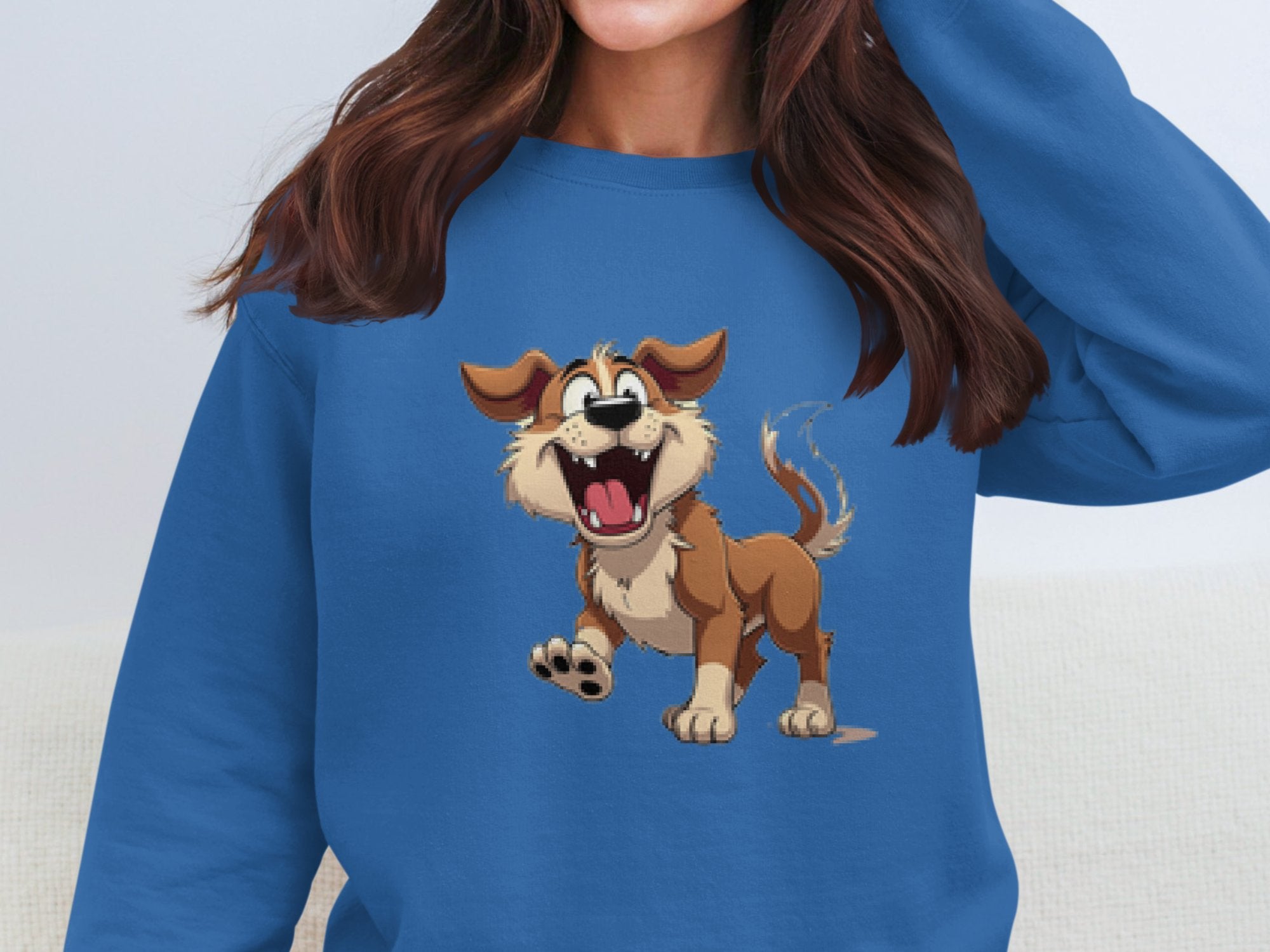A person wears a Garment Graphics blue sweatshirt ideal for dog lovers, featuring an animated happy brown and beige dog with an open mouth and wagging tail. The persons face is hidden from view.
