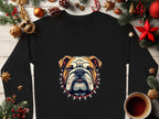 A Garment Graphics black sweatshirt with a bulldog and spiked collar design sits on wood surrounded by Christmas decorations like pine branches, ornaments, gingerbread cookies, and coffee. Available in unisex sizes for versatile style.