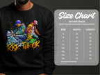 A man sports a black sweatshirt featuring vibrant street dance graphics of two figures and Risk Taker. The Garment Graphics Gildan 18000 offers unisex sizing from S to 5XL, with a convenient size chart for width and length in inches.