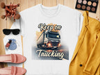 Garment Graphics unisex graphic sweatshirt, Keep on Trucking, is styled in a flat lay with makeup brushes, a palette, sunglasses, lipstick, pink loafers, a small pouch, and a yellow blazer on a wooden surface.