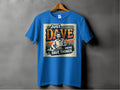 The Garment Graphics blue graphic T-shirt features a classic fit and a design of a man with the phrase Just Dave Doing Dave Things, set against a colorful sunset and forest elements, displayed on a gray wall.