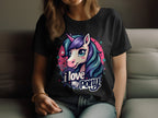 A person relaxes on a couch wearing a Garment Graphics black t-shirt adorned with a vibrant unicorn graphic: blue and purple mane, pink horn, I Love My Pony text. Ideal for unicorn fans, it features stars and a pink circle as they rest their hand on their knee.