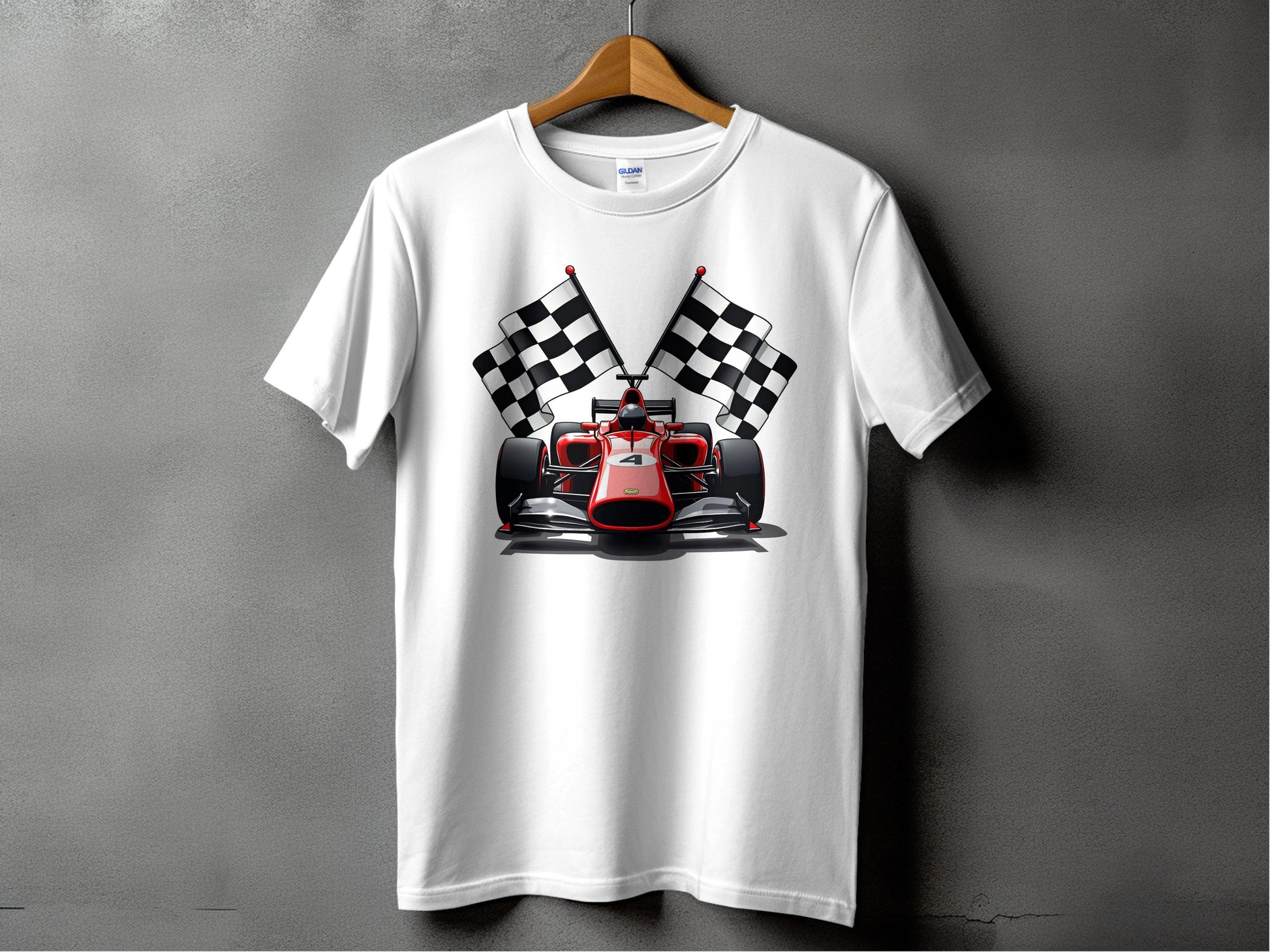 A white T-shirt from Garment Graphics, featuring a stylish race car design with a red car and crossed checkered flags, hangs on a wooden hanger against a plain gray wall—ideal for motorsport enthusiasts.
