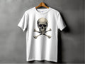 A white Garment Graphics T-shirt on a wooden hanger set against a gray background features a striking skull and crossbones design, perfect for bold graphic T-shirt enthusiasts.