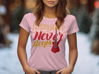 In a softly blurred outdoor setting, a woman models Garment Graphics standout T-shirt—a pink tee with Music Never Sleeps in vibrant colors and a bold red electric guitar graphic. Only her upper body is visible, showcasing the essence of stylish guitar-themed apparel.