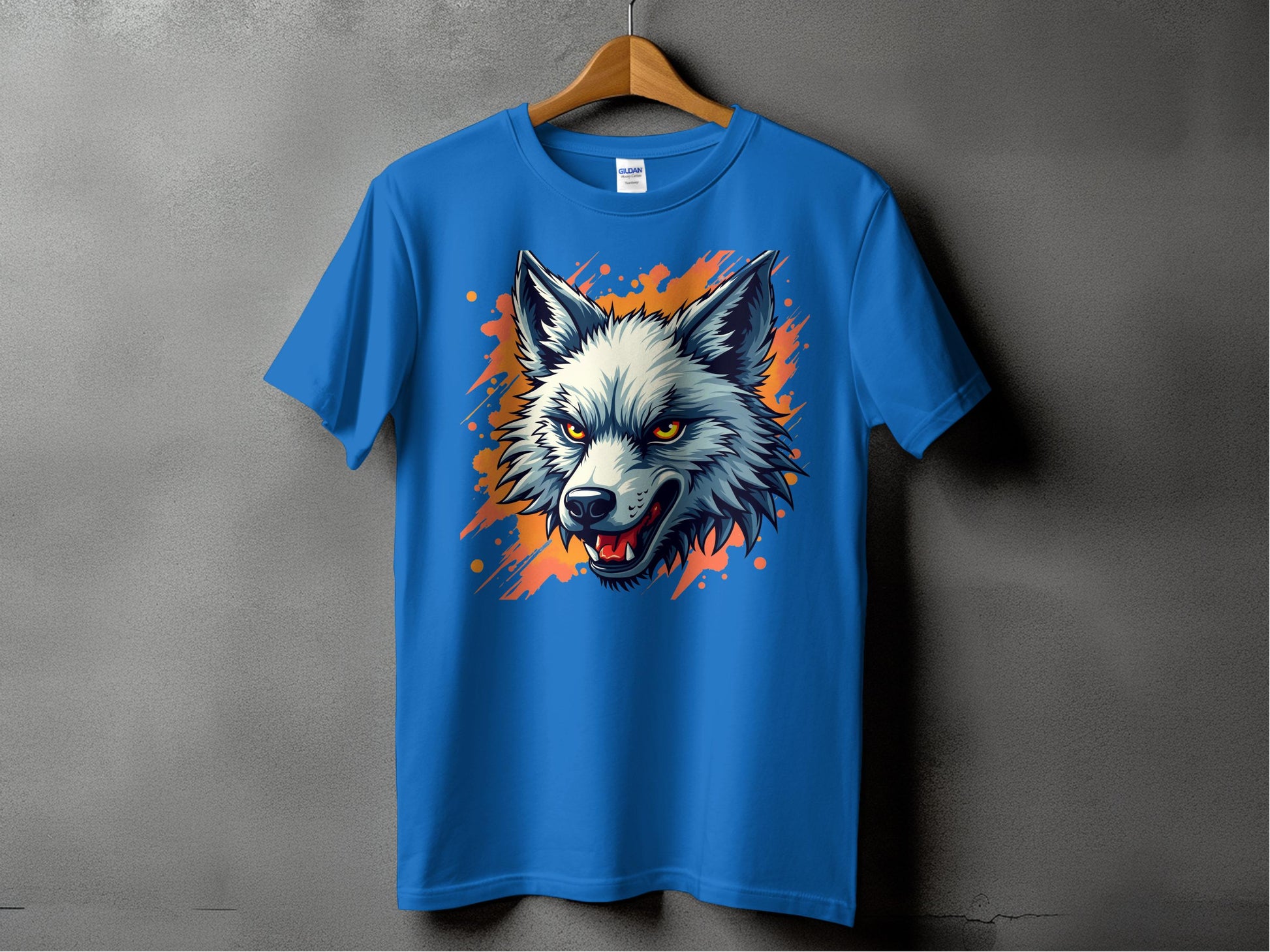 Garment Graphics presents a stylish blue T-shirt on a wooden hanger, featuring a bold wolf graphic with orange splashes. Set against a gray background, this tee exudes fearless personality.