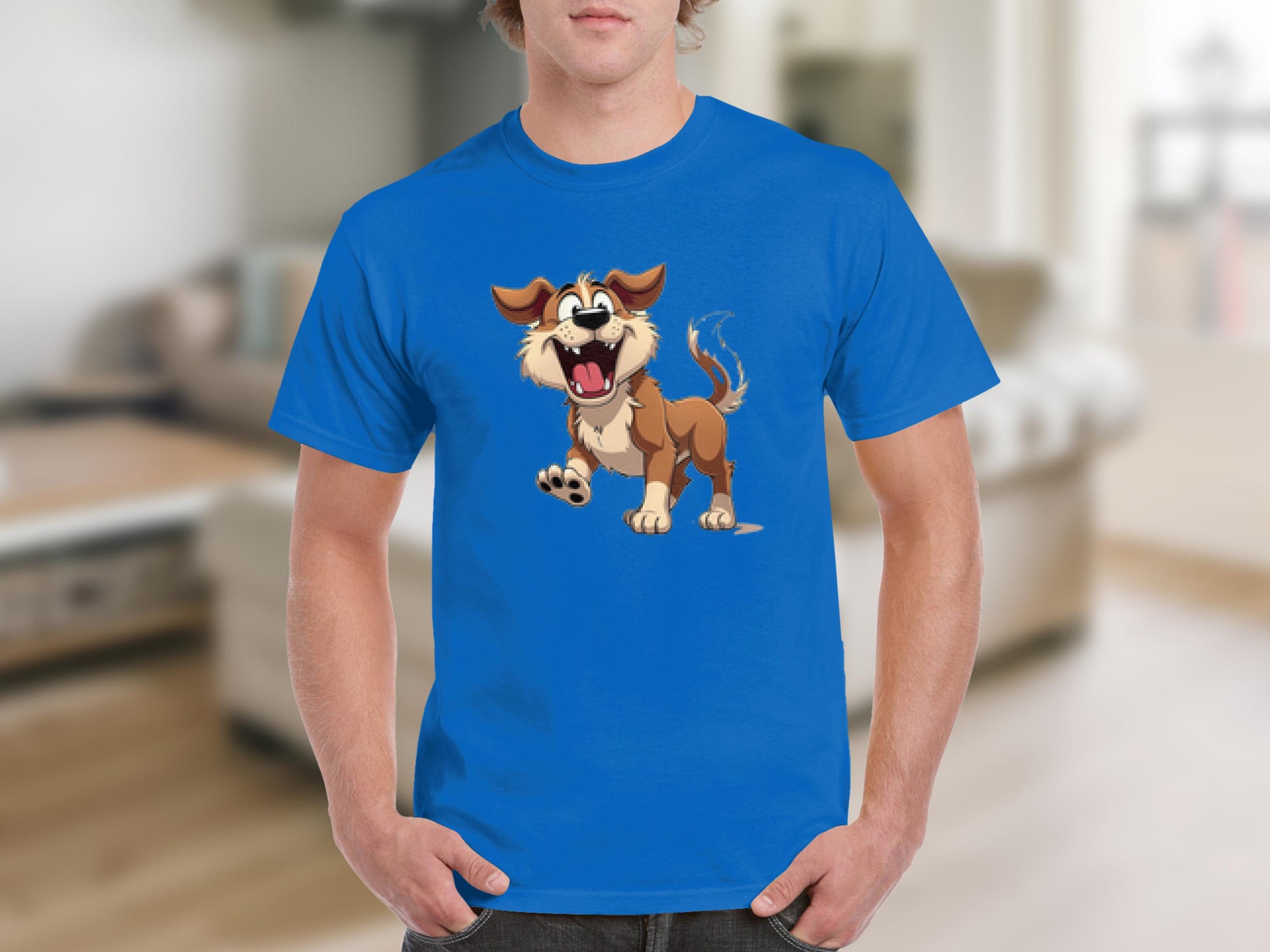 A person wears a blue Garment Graphics T-shirt, ideal for dog lovers, featuring a cartoon dog joyfully on its hind legs. The soft blur of a modern living room with a cozy sofa and table creates the backdrop.