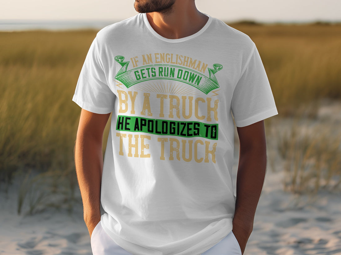 A Garment Graphics black t-shirt with a witty design: If an Englishman gets run down by a truck, he apologizes to the truck, is showcased next to a water bottle, cloth towel, basketball, and black athletic shorts.