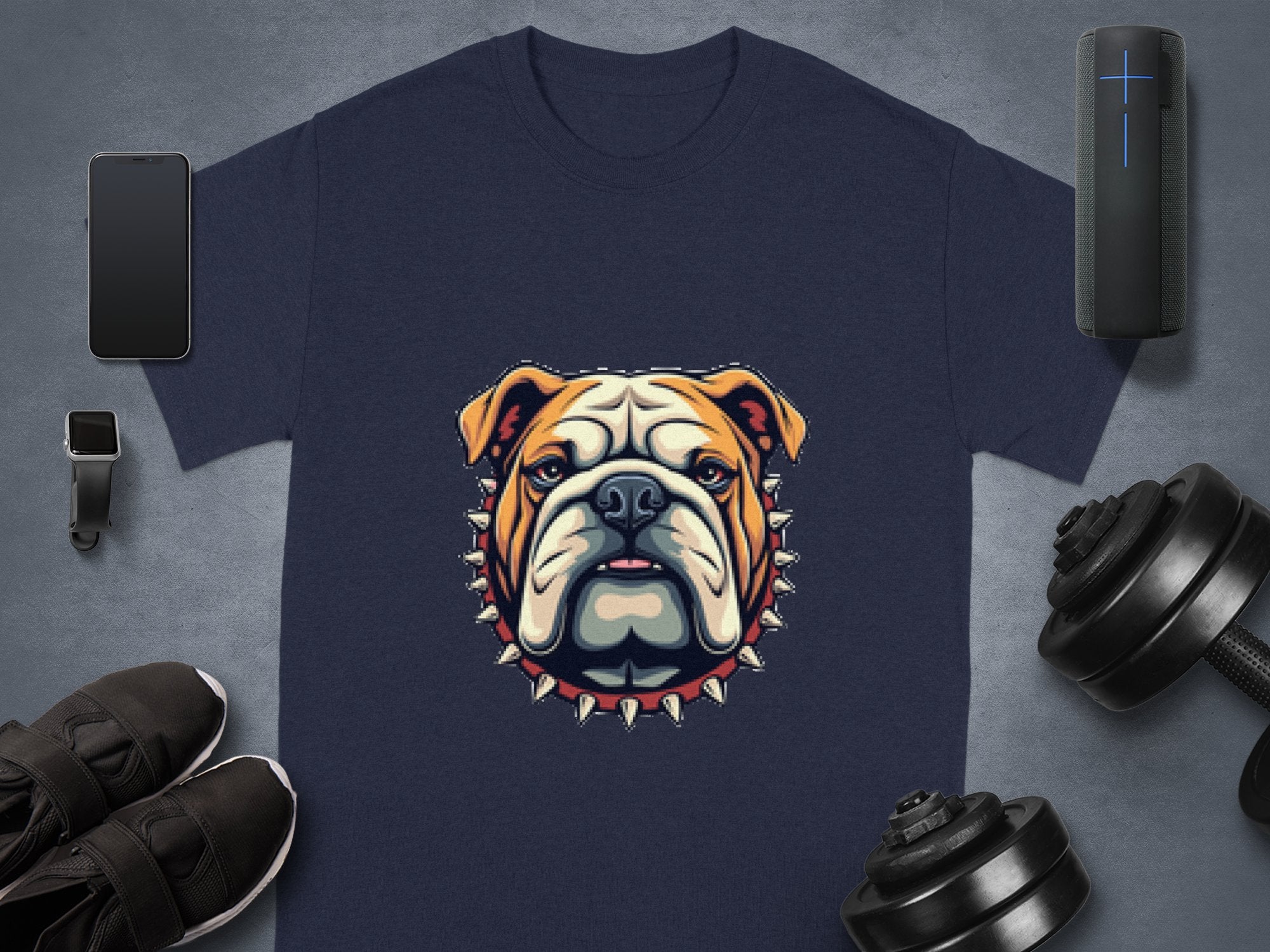 Garment Graphics presents a stylish dark blue T-shirt showcasing a bulldog with a spiked collar. Surrounding items include: smartphone, smartwatch, wireless speaker, black sneakers, adjustable dumbbells on grey background. Perfect for family sizing to match everyone in style.