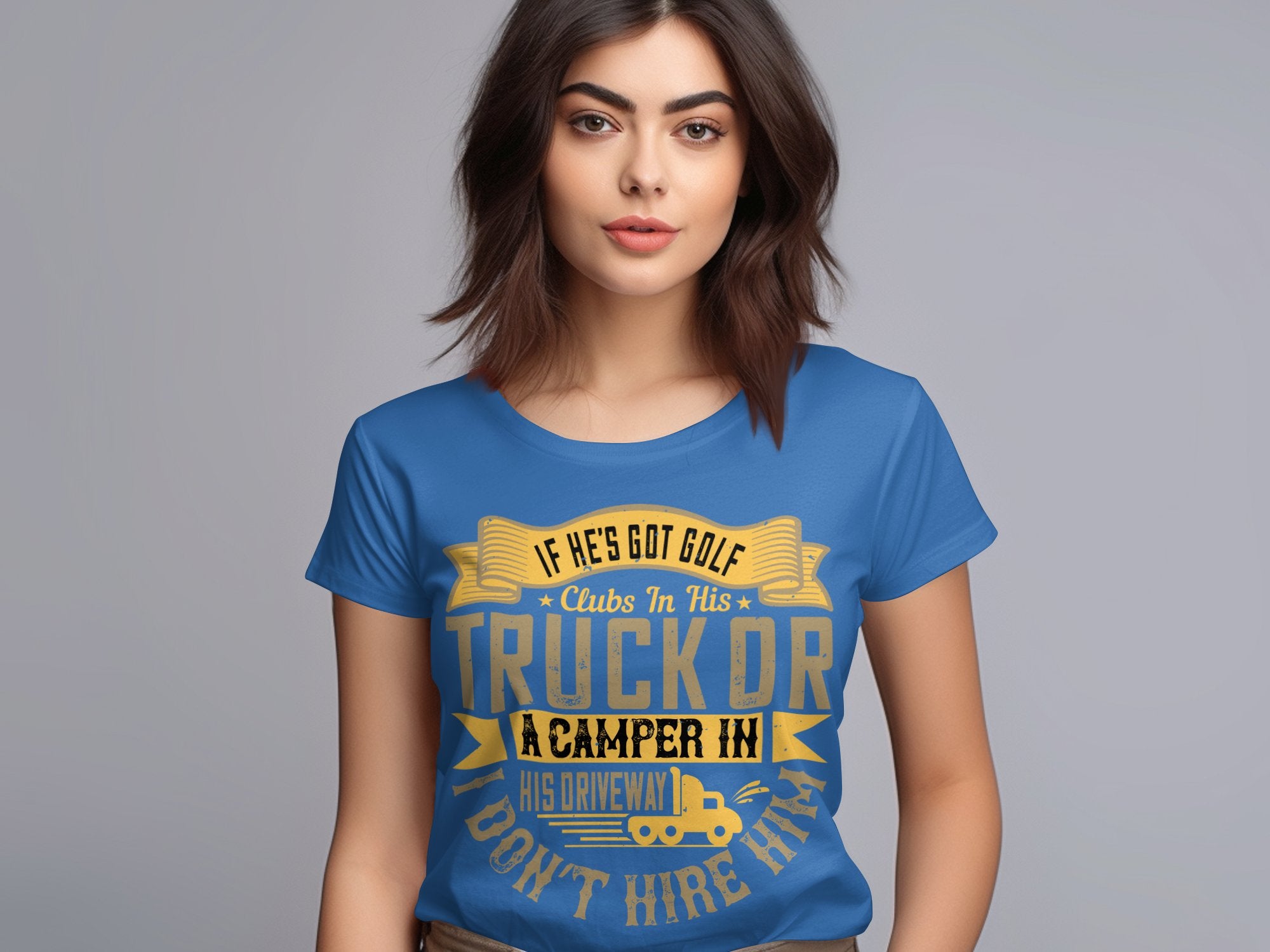 A woman with long brown hair stands against a plain background, wearing a blue Garment Graphics T-shirt displaying a quirky golf print: If hes got golf clubs in his truck or a camper in his driveway, dont hire him. Designed for women’s sizing to ensure the perfect fit.