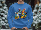 A man models a vibrant blue Garment Graphics sweatshirt with Risk Taker and Street Dance 10th Final street dance graphics against snowy trees. This urban-style piece offers unisex sizing to capture the vibe.