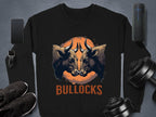 The Garment Graphics black sweatshirt features a striking bullock design with two bulls facing each other and an orange sun-like circle above the word BULLOCKS. Unisex sizing makes it versatile, pairing well with a smartphone, smartwatch, shoes, speaker, or dumbbells for any style.