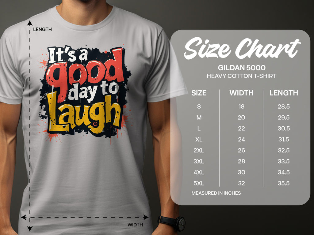 A person is wearing a Garment Graphics Its a Good Day to Laugh t-shirt, adorned with a cheerful message in vibrant colors. Next to them is the Gildan 5000 heavy cotton size chart, showing sizes S to 5XL with width and length in inches.