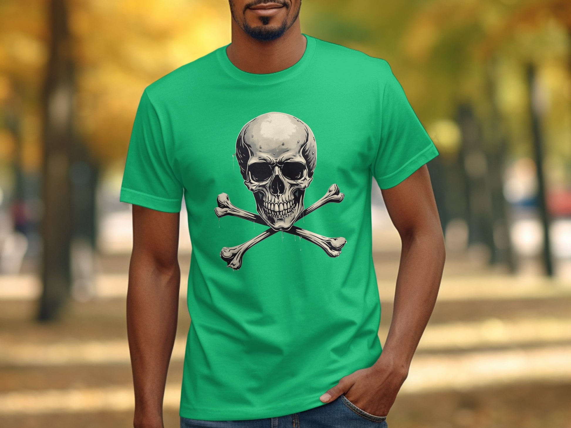Wearing a vivid green t-shirt with Garment Graphics iconic skull and crossbones design, a person stands in a park framed by blurred autumn trees amidst a leaf-covered path, making a bold fashion statement.