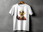 A Garment Graphics classic fit T-shirt hangs on a wooden hanger, featuring a cartoon eagle with large green eyes and a thumbs-up. This fun wardrobe staple pops against the solid gray wall.