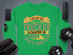 Garment Graphics offers a green sweatshirt proclaiming, IF HES GOT GOLF CLUBS IN HIS TRUCK OR A CAMPER IN HIS DRIVEWAY I DONT HIRE HIM, with a fun ribbon, golf club, and camper design. Ideal for casual wear, it pairs perfectly with sneakers, dumbbells, your phone, or speaker.
