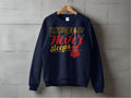 A vibrant navy blue sweatshirt by Garment Graphics hangs on a wooden hanger against a concrete wall. Perfect for music lovers, it features Music Never Sleeps in gold and red with an electric guitar illustration.