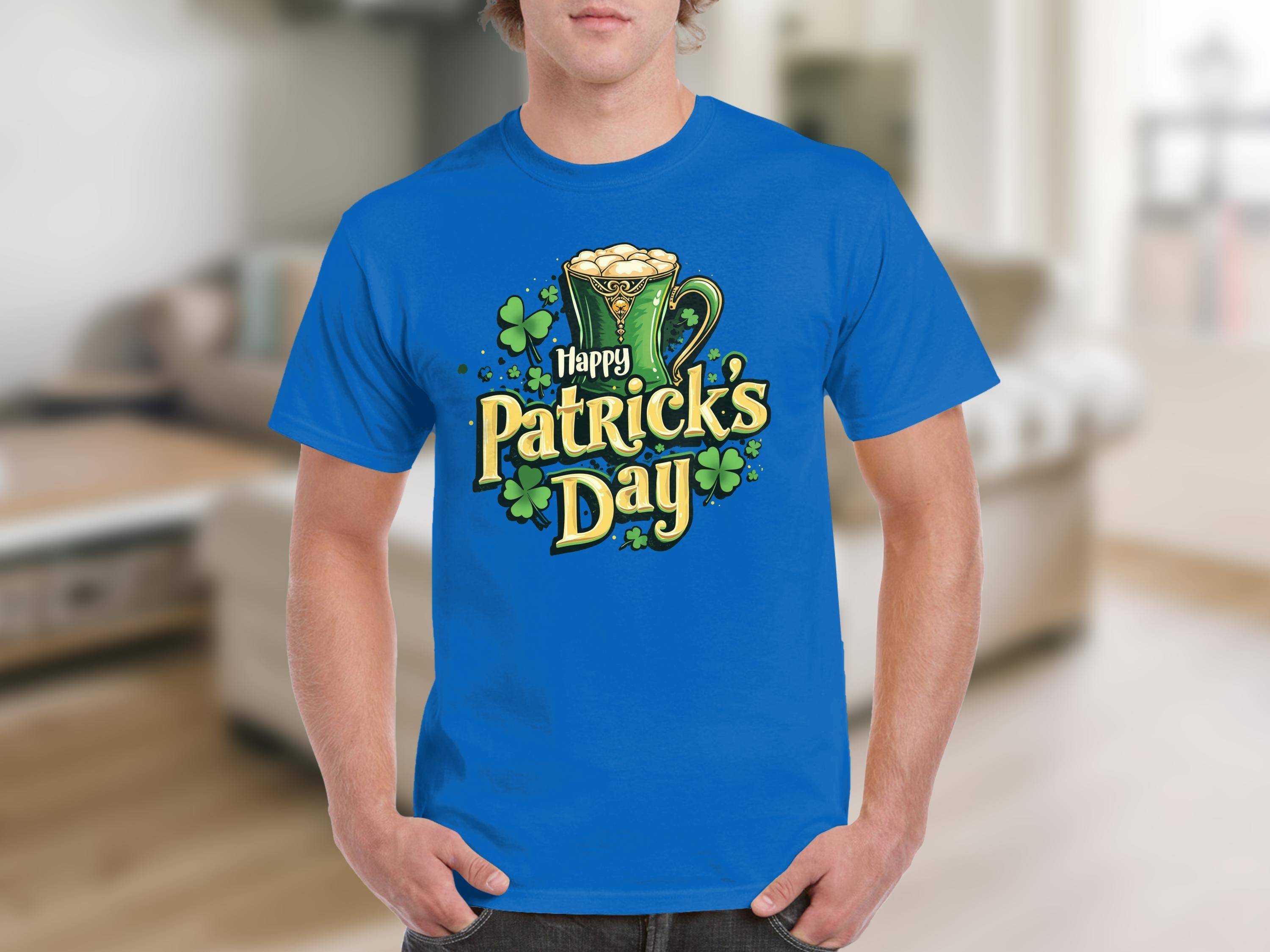 A person in a Garment Graphics Happy Patricks Day T-Shirt featuring a bold beer mug, shamrocks, and Happy Patricks Day text design stands against the bustling, blurred background of St. Patrick’s indoor festivities.