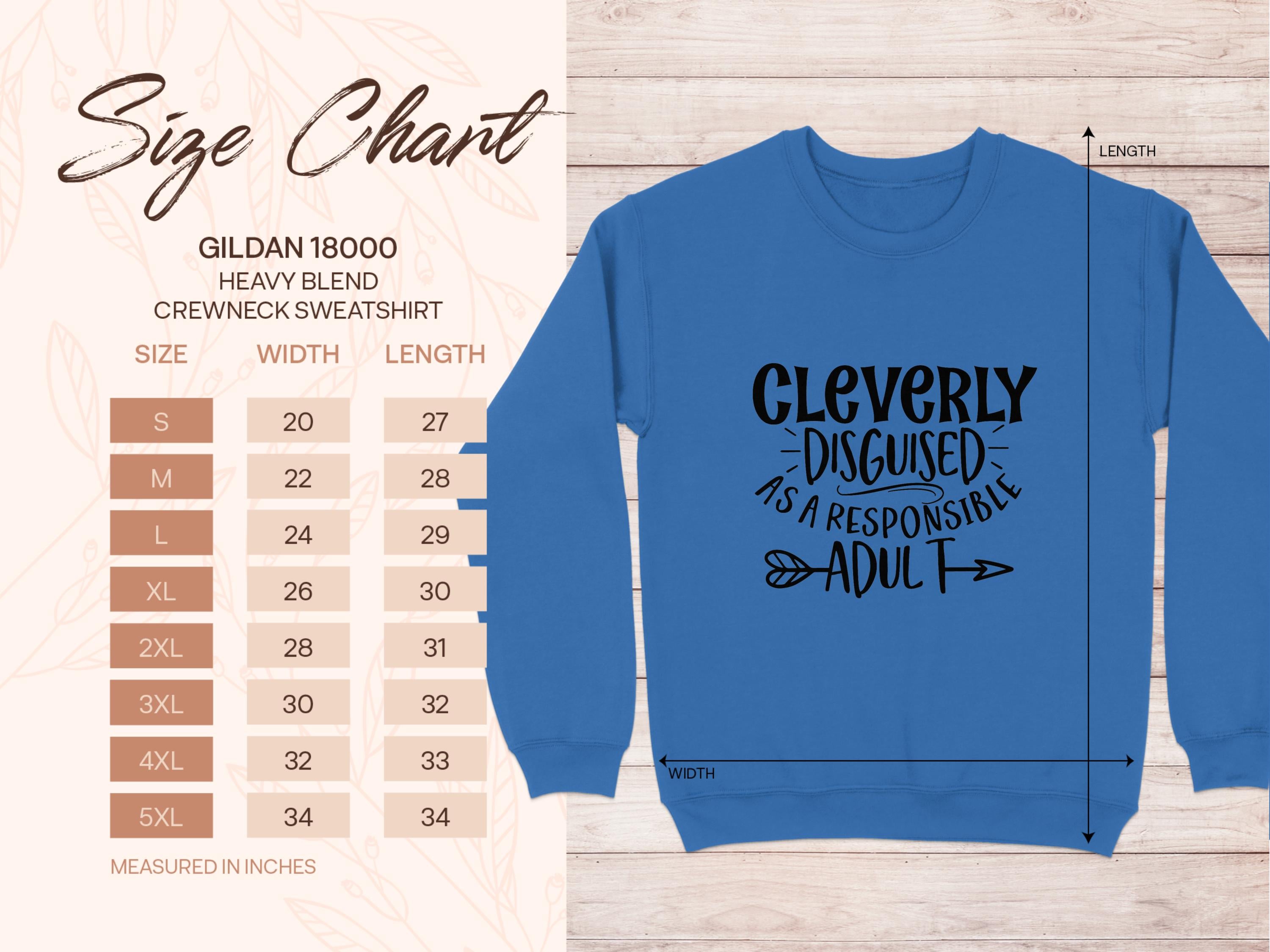 A size chart for the Garment Graphics 18000 crewneck, ideal for adding humor to your wardrobe, accompanies a blue sweatshirt that reads Cleverly disguised as a responsible adult with two arrows. Unisex sizes range from small to 5XL, detailing corresponding width and length measurements.