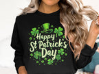 A woman with long, wavy blonde hair dons a Garment Graphics festive sweatshirt featuring shamrocks, a leprechaun hat, and Happy St Patricks Day. Her face isnt visible, but her joyful celebration is clear.