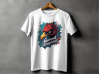 A white T-shirt with a classic fit is displayed on a wooden hanger against a gray background, featuring an eagle design with a fierce red bird head above the brand name Garment Graphics in stylized lettering.