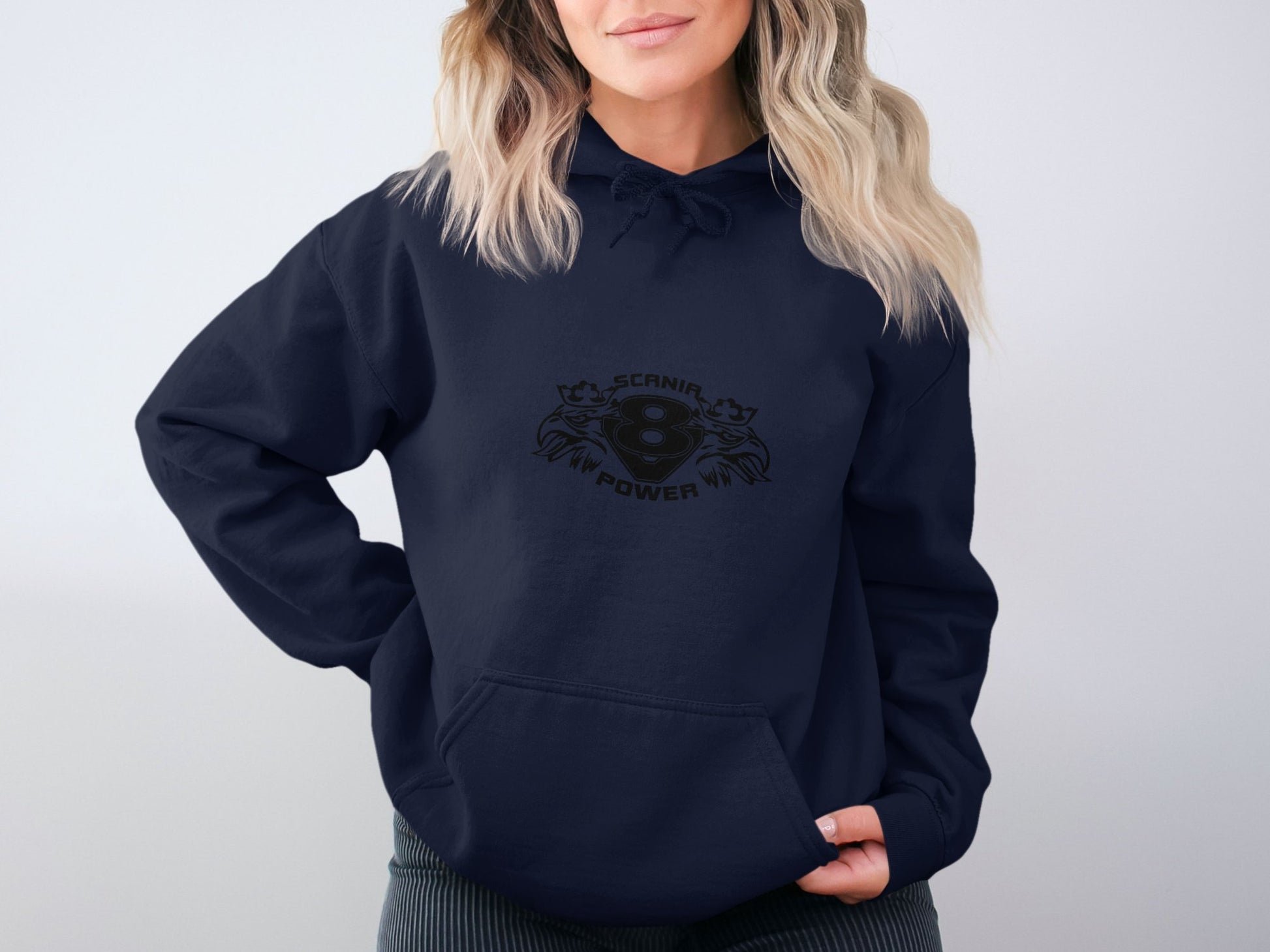 A person sports a navy blue hoodie from Garment Graphics, showcasing a bold black design with two cats and SCARINA POWER 4. Its classic fit complements their wavy blond hair against a plain white background.