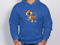 Sporting a whimsical wardrobe piece, this blue Garment Graphics hoodie showcases a cartoon image of a smiling, playful dog on the front. Ideal for dog lovers, the wearer casually slips their hands into the pocket, highlighting this charming cartoon puppy design.