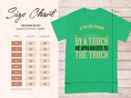 On the left, a size chart for a Garment Graphics Gildan 5000 heavy cotton t-shirt, featuring sizes S to 5XL with width and length in inches. On the right, a witty green t-shirt design: If an Englishman gets run down by a truck, he apologizes to the truck. Top-notch humorous T-Shirts!.