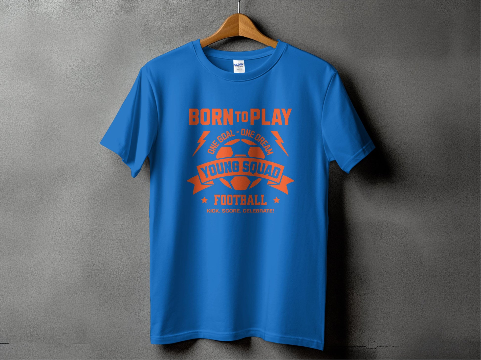 Garment Graphics’ blue t-shirt features bold orange Born to Play text on a gray background. A football graphic sits below, with Young Squad Football and the motto Kick. Score. Celebrate. Its ideal for true football dreamers and enthusiasts.