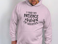 Someone is wearing a classic fit, light pink hoodie by Garment Graphics featuring I had my patience tested Im negative in black text, made from medium-heavy fabric for comfort.