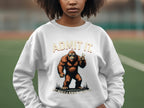 A person wearing a white sweatshirt from Garment Graphics, featuring a cartoon Bigfoot with a peace sign, enjoys the outdoors on a green field. It reads ADMIT IT above and IT WOULD BE A BORING WORLD below. The unisex design ensures everyone can enjoy this casual wear.