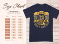 A navy blue Garment Graphics T-shirt features the humorous quote, If hes got golf clubs in his truck or a camper in his driveway, I dont hire him. Its an ideal gift and includes a Gildan 5000 size chart with sizes S to 5XL, providing exact width and length measurements.