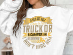 A person is wearing a white sweatshirt from Garment Graphics, featuring a witty graphic and the phrase: If hes got golf clubs in his truck or a camper in his driveway, dont hire him, enhanced with unique designs of a golf club and camper.