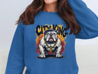 A person wears a blue sweatshirt featuring a cartoon bulldog with a gold chain and an R pendant. The words City King stand boldly above, making this Garment Graphics piece from the Bulldog Sweatshirts collection trendy and chic.