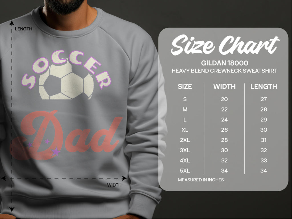 A person wears a gray Soccer Dad sweatshirt from Garment Graphics, featuring a soccer ball design. Next to them is a size chart for these trendy unisex sweatshirts, available in sizes S to 5XL with width and length measurements in inches.