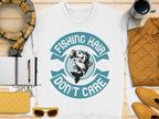 Garment Graphics offers a white T-shirt with Fishing Hair Dont Care text and a fish graphic, ideal for fishing enthusiasts. Displayed on wood with a notebook, pen, yellow sunglasses, purse, plaid scarf, black coffee cup, and mustard jacket in the background.